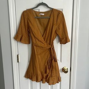 Yellow/white polka dot mini dress with tie on the side